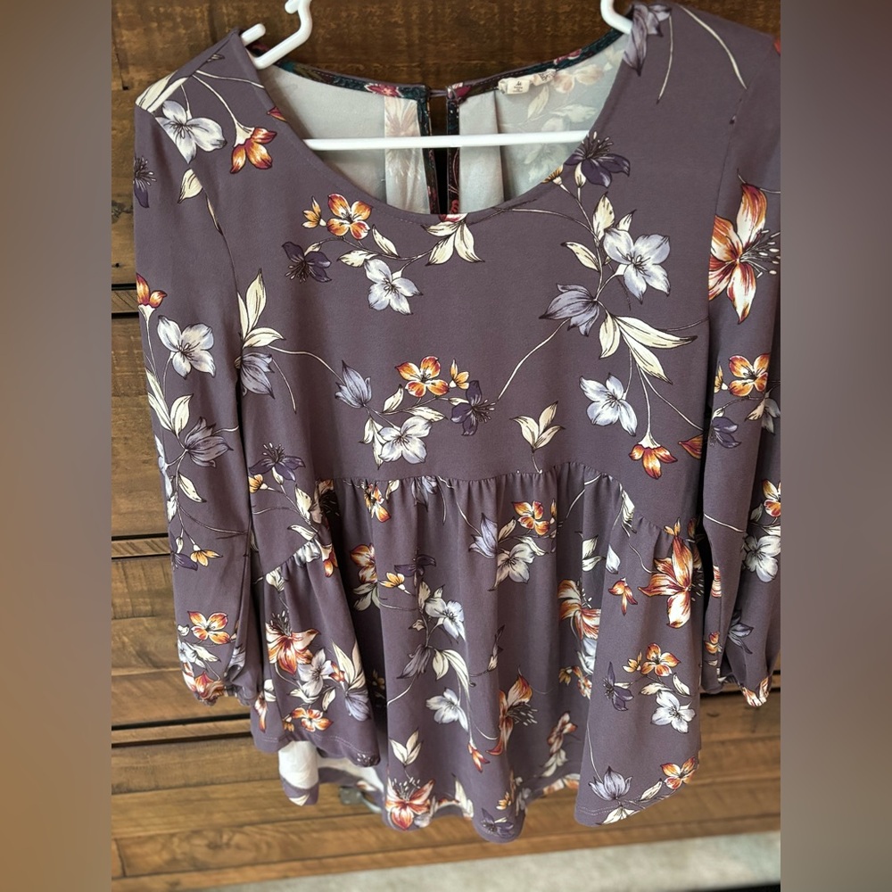 Floral hem and thread peplum top